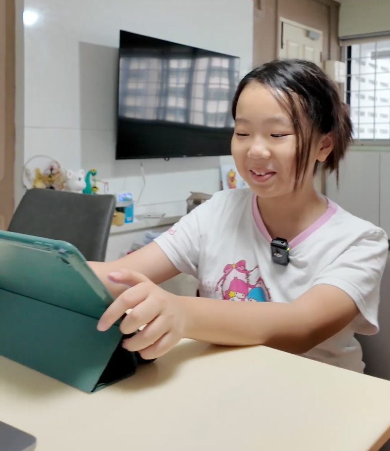 Alicia using a tablet at a table